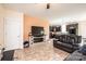 Comfortable living room featuring a cozy fireplace, modern television, and plush leather seating at 3659 Vashti Rd, Taylorsville, NC 28681