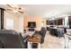 Spacious living room featuring leather furniture, ceiling fan, and open access to the kitchen and dining area at 3659 Vashti Rd, Taylorsville, NC 28681