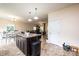 Open floor plan showcasing kitchen island, dining area, and living room with seamless transition between spaces at 3659 Vashti Rd, Taylorsville, NC 28681