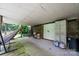 Covered outdoor space with a hammock and convenient storage, seamlessly blending relaxation and utility at 3659 Vashti Rd, Taylorsville, NC 28681