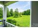 Breathtaking view of lush green yard from the front porch of this home at 3659 Vashti Rd, Taylorsville, NC 28681