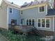 The backyard features a wood deck and lush greenery, perfect for outdoor entertaining at 3664 Gaston Day School Rd, Gastonia, NC 28056
