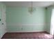 Bright dining room featuring a chandelier and decorative wall trim at 3664 Gaston Day School Rd, Gastonia, NC 28056