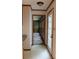 Bright hallway with a tiled floor and an open view into the room with lots of windows at 3664 Gaston Day School Rd, Gastonia, NC 28056