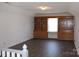 Bright living room features built-in bookshelves and cabinets, providing ample storage and display space at 3664 Gaston Day School Rd, Gastonia, NC 28056