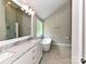 Bright bathroom with a double vanity with marble countertops and soaking tub at 3905 Brittany Ct, Indian Trail, NC 28079