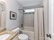 Bathroom with granite vanity and shower-tub with neutral tile at 3905 Brittany Ct, Indian Trail, NC 28079