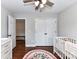 Bedroom with hardwood floors, crib and changing table at 3905 Brittany Ct, Indian Trail, NC 28079