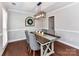 Cozy dining area with rustic wooden table, gray chairs and elegant crown molding at 3905 Brittany Ct, Indian Trail, NC 28079