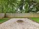 Dedicated fire pit area with gravel surround and a rustic brick fire pit at 3905 Brittany Ct, Indian Trail, NC 28079