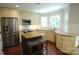 Bright kitchen features granite countertops, stainless appliances, and an island with bar stool seating at 3905 Brittany Ct, Indian Trail, NC 28079