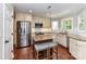 Kitchen featuring stainless steel appliances, a center island, and hardwood floors at 3905 Brittany Ct, Indian Trail, NC 28079