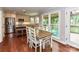 Open kitchen and eat-in area with hardwood floors and stainless steel appliances at 3905 Brittany Ct, Indian Trail, NC 28079