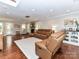 Spacious living room featuring a stone fireplace, hardwood floors, and a comfortable seating area at 3905 Brittany Ct, Indian Trail, NC 28079