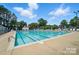 Community pool with multiple lanes and plenty of lounge chairs at 3905 Brittany Ct, Indian Trail, NC 28079