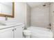 Bathroom featuring vanity, white cabinets, gray countertop, bathtub and shower at 43 Paddington Sw Dr, Concord, NC 28025