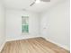 A bright bedroom with light walls, wood floor and window at 43 Paddington Sw Dr, Concord, NC 28025