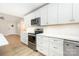 Well-appointed kitchen with stainless steel appliances, white cabinets, and light countertops creating efficient cooking space at 43 Paddington Sw Dr, Concord, NC 28025