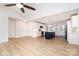 Bright, open-concept kitchen with an island, stainless steel appliances, and wood flooring for a modern, airy feel at 43 Paddington Sw Dr, Concord, NC 28025