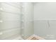 The walk-in closet boasts ample shelving for organized storage and tidy space at 43 Paddington Sw Dr, Concord, NC 28025