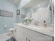 Stylish bathroom featuring double sinks, vanity, and modern fixtures at 4420 Bright Rd, Charlotte, NC 28214