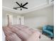 Spacious primary bedroom with ceiling fan and adjoining bathroom at 4420 Bright Rd, Charlotte, NC 28214
