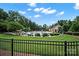 A refreshing community pool surrounded by lush greenery offers a relaxing retreat at 4420 Bright Rd, Charlotte, NC 28214