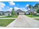 Well-maintained front yard and charming home featuring a two-car garage at 4420 Bright Rd, Charlotte, NC 28214
