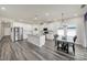 Modern kitchen features stainless steel appliances, white cabinetry and a dining area with natural light at 4420 Bright Rd, Charlotte, NC 28214