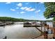 A scenic view of the lake featuring boat docks perfect for waterside enjoyment at 4420 Bright Rd, Charlotte, NC 28214