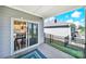 View from porch showcases sliding door to kitchen/dining area with landscaped backyard at 4420 Bright Rd, Charlotte, NC 28214
