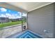 Charming screened porch with a view of the grassy backyard at 4420 Bright Rd, Charlotte, NC 28214