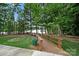 Picturesque wooden walkway winds through a serene park with lake views at 4420 Bright Rd, Charlotte, NC 28214