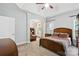 Comfortable bedroom with an attached sitting room and ample natural light streaming through the windows at 4605 Sarandon Ct, Charlotte, NC 28215