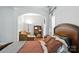 Comfortable bedroom with an attached sitting room and ample natural light streaming through the windows at 4605 Sarandon Ct, Charlotte, NC 28215