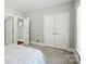 Bedroom featuring a bed, closet, carpeted floor, and neutral colored walls at 4605 Sarandon Ct, Charlotte, NC 28215