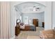 Spacious primary bedroom with neutral tones, a ceiling fan, and a view of the ensuite bathroom at 4605 Sarandon Ct, Charlotte, NC 28215