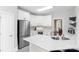 Well-equipped kitchen with white cabinets, stainless steel appliances, and a convenient breakfast bar at 4605 Sarandon Ct, Charlotte, NC 28215