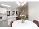 Bright kitchen with white cabinets, a breakfast bar, and modern countertops and backsplash at 4605 Sarandon Ct, Charlotte, NC 28215