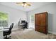 Bright office space with natural light, neutral carpet, and wood accents at 4605 Sarandon Ct, Charlotte, NC 28215