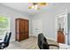 Bright office space with natural light, ceiling fan, and ample storage, perfect for a productive work environment at 4605 Sarandon Ct, Charlotte, NC 28215