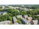 Stunning aerial view of townhomes with lush greenery and tree coverage in a vibrant neighborhood setting at 4854 S Hill View Dr, Charlotte, NC 28210