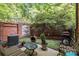 Cozy courtyard featuring brick walls, seating and a grill, perfect for outdoor relaxation at 4854 S Hill View Dr, Charlotte, NC 28210