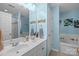 Bright bathroom featuring double sinks, large mirror, and a separate shower and tub at 4854 S Hill View Dr, Charlotte, NC 28210