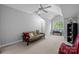 Spacious bedroom with vaulted ceilings, a ceiling fan, and natural light from a window at 4854 S Hill View Dr, Charlotte, NC 28210