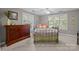 Bedroom featuring neutral carpet, a dresser, a bed with pillows, and natural light at 4854 S Hill View Dr, Charlotte, NC 28210