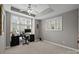Bedroom featuring carpeted floors, bright windows, ceiling fan, and a workspace at 4854 S Hill View Dr, Charlotte, NC 28210
