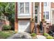 Attractive brick townhome with a single-car garage, private entrance, and well-maintained landscaping at 4854 S Hill View Dr, Charlotte, NC 28210