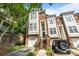 Charming brick townhome with a garage, front staircase, and ample natural light at 4854 S Hill View Dr, Charlotte, NC 28210