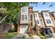 Beautiful brick townhome featuring a single-car garage, private entrance, and mature landscaping at 4854 S Hill View Dr, Charlotte, NC 28210